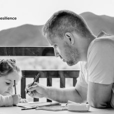 Father and daughter drawing together